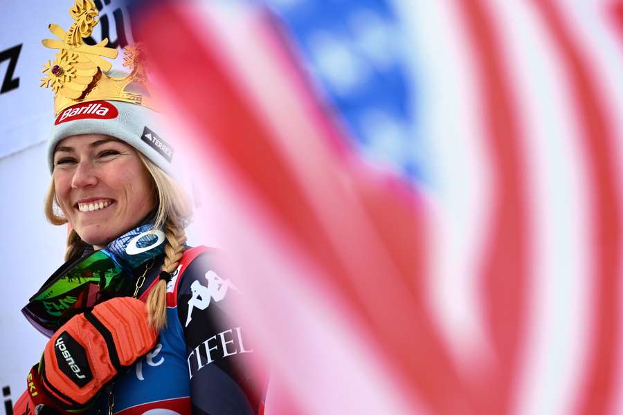 Shiffrin celebrates on the podium after winning the Giant Slalom at Kronplatz