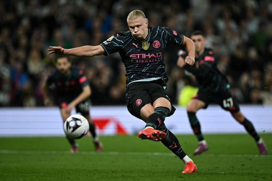 Erling Haaland shoots a penalty kick and scores his team's second goal