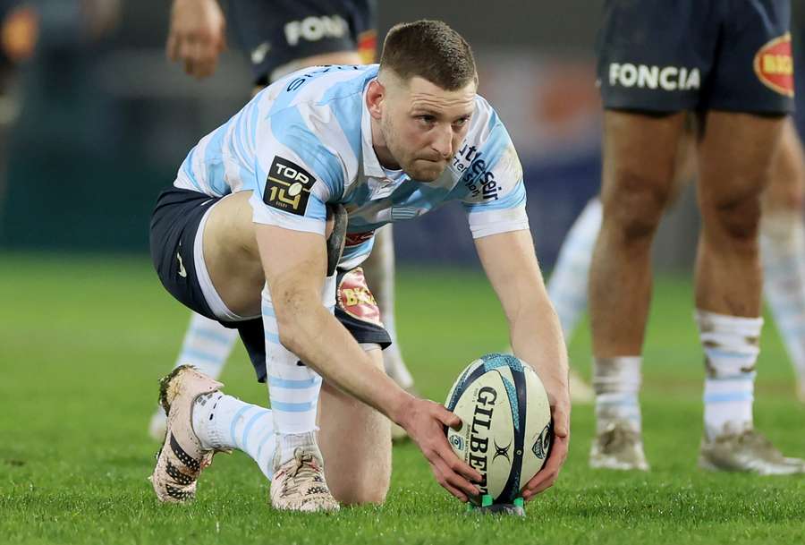 Racing92's Scottish fly-half Finn Russell concentrates as he aligns the ball