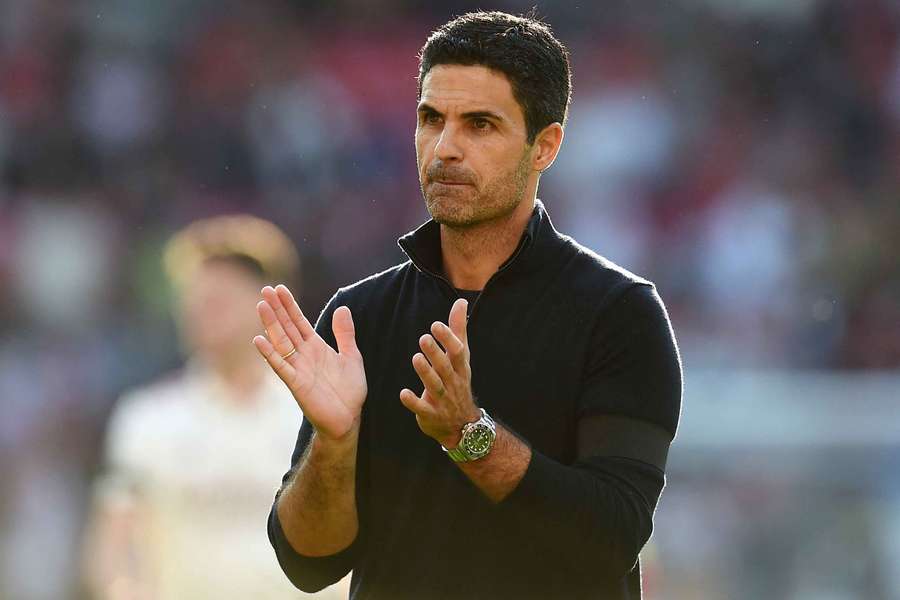 Mikel Arteta applauds the Arsenal fans after the win