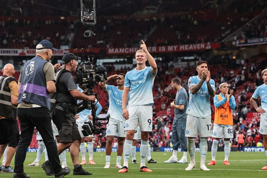 Goalscorer Erling Haaland celebrates Man City's win against Man Utd