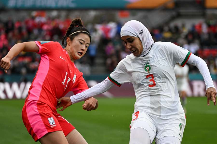 South Korea's forward #11 Choe Yu-Ri (L) and Morocco's defender #03 Nouhaila Benzina fight for the ball 