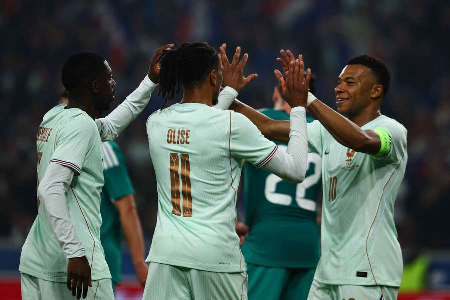 Dembele (left) celebrates with Olise and Mbappe Dembele (left) celebrates with Olise and Mbappe