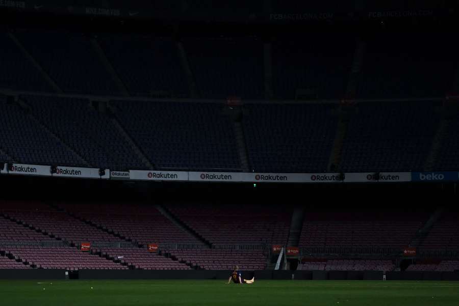 FC Barcelona's Andres Iniesta sits on the pitch after his last game for the club FC Barcelona's Andres Iniesta sits on the pitch after his last game for the club
