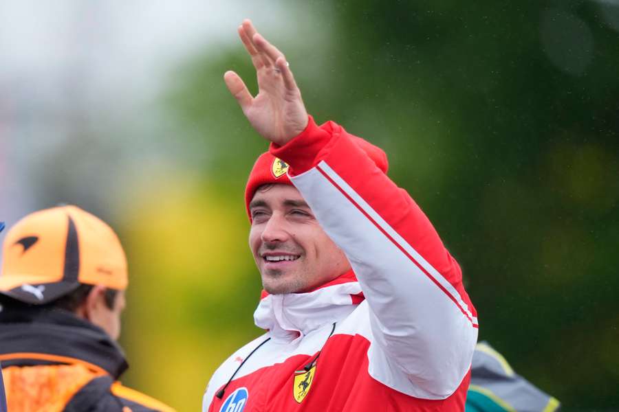 Charles Leclerc waves to supporters