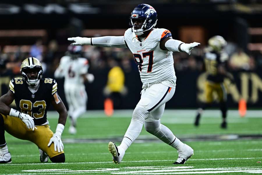 Broncos DT Malcolm Roach celebrates after a play (2024)