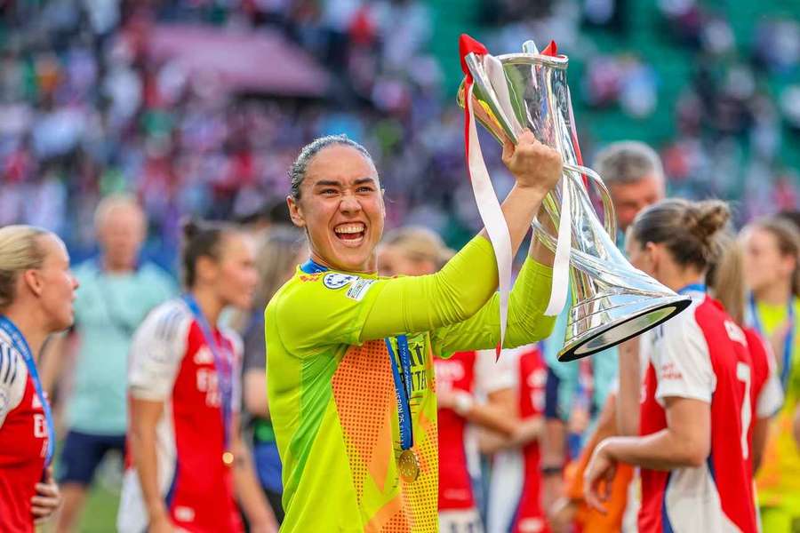 Arsenal goalkeeper Manuela Zinsberger holds the Women's Champions League trophy