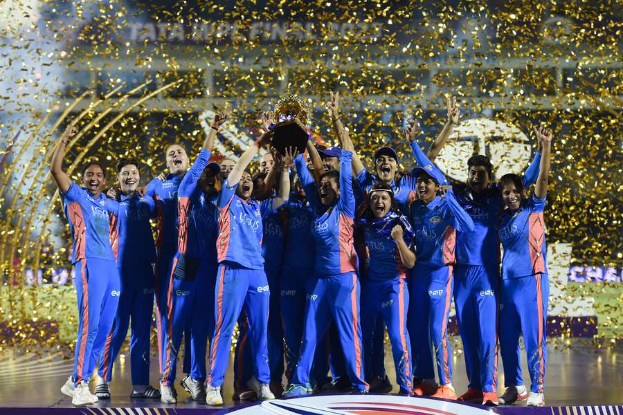 Mumbai Indians' players celebrate winning the 2023 WPL