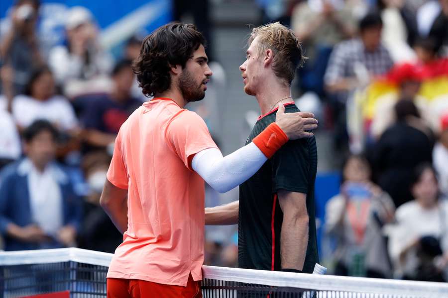 Alcaraz and Shapovalov embrace after the match