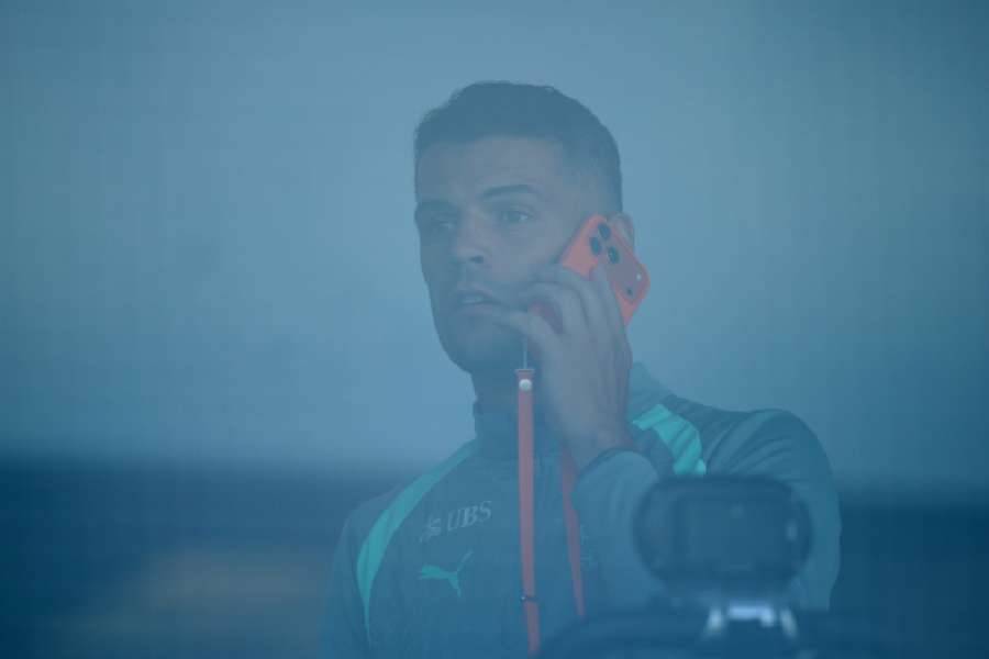 Xhaka on the phone during Switzerland training Xhaka on the phone during Switzerland training