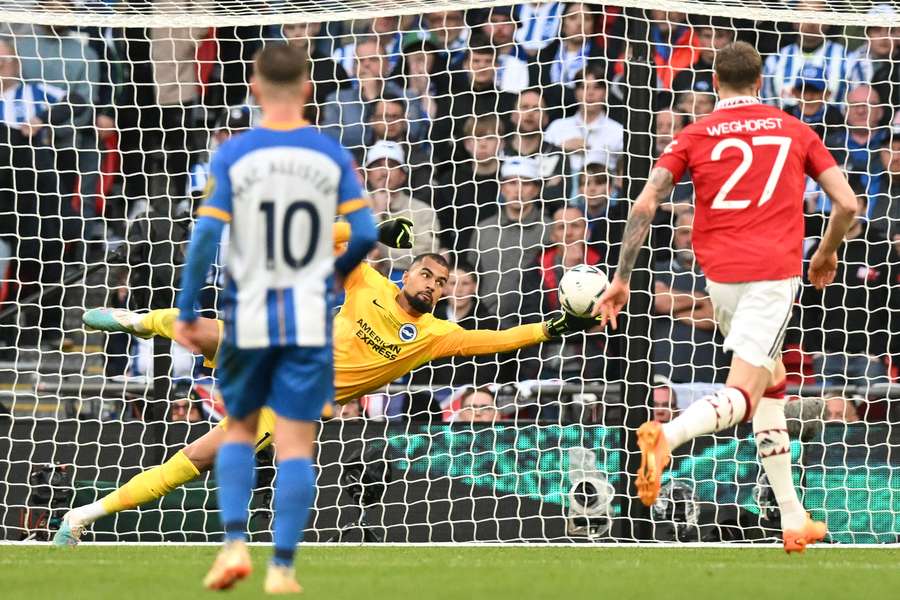Brighton's Spanish goalkeeper Robert Sanchez saves a shot from Manchester United's English striker Marcus Rashford Brighton's Spanish goalkeeper Robert Sanchez saves a shot from Manchester United's English striker Marcus Rashford