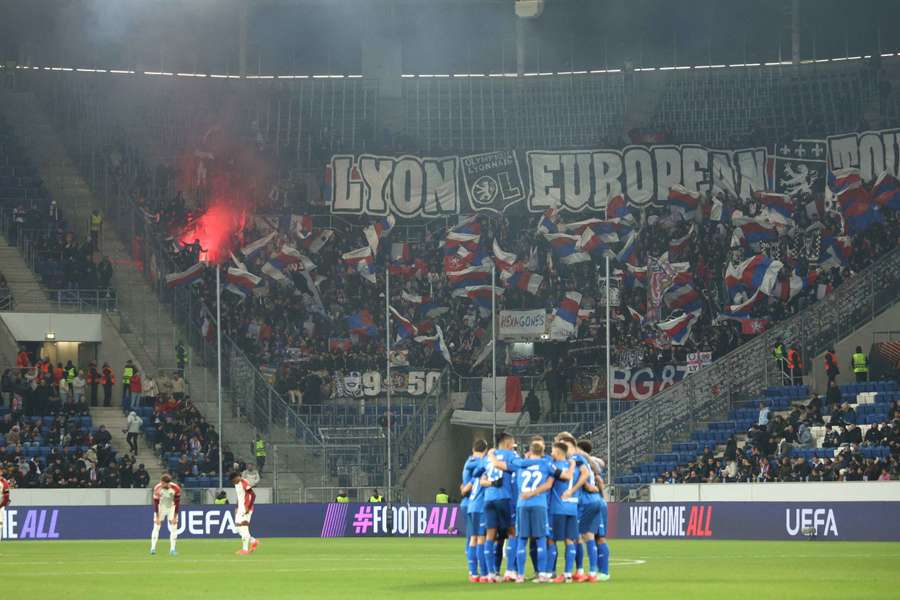 Fans of Olympique Lyonnais show their support in the stands 