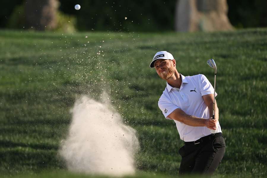 Jesper Svensson plays his third shot from a bunker on the ninth hole during day two of the Bahrain Championship