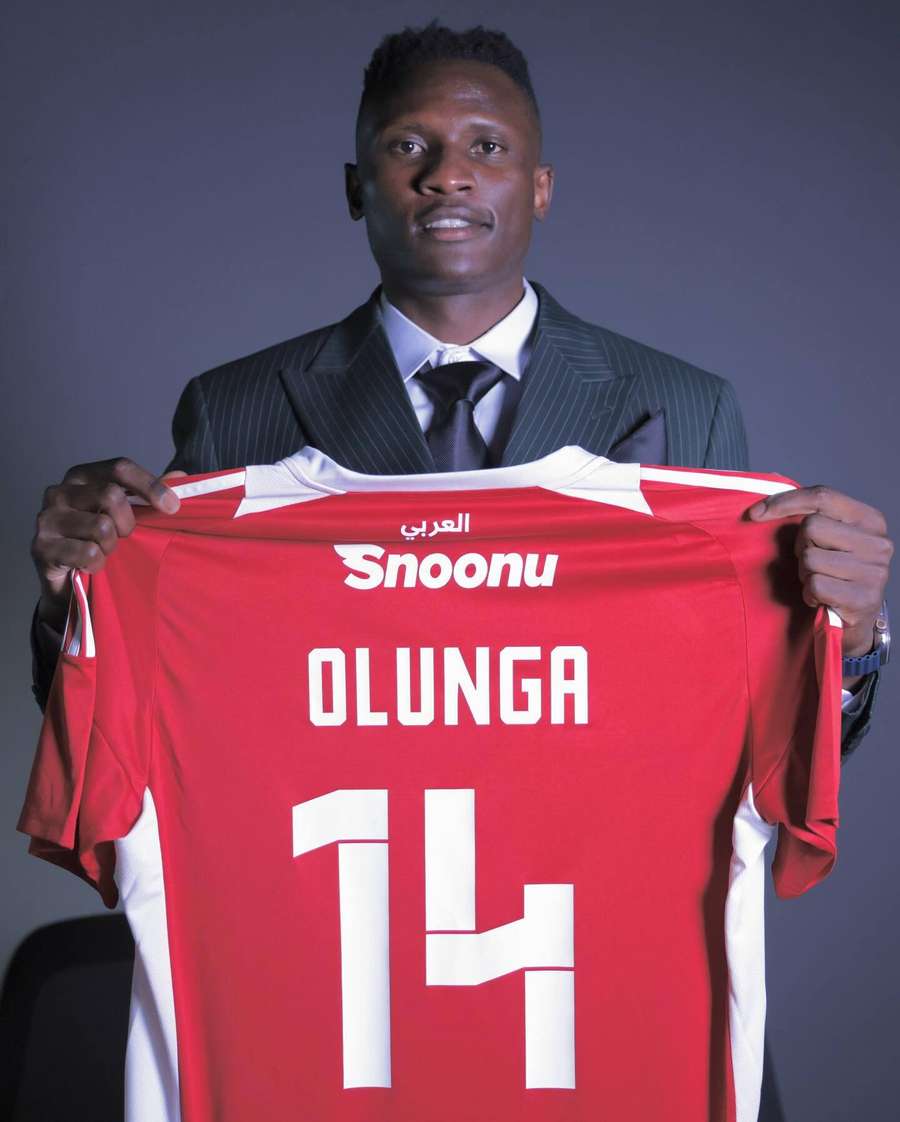 Olunga holding an Al Arabi shirt Olunga holding an Al Arabi shirt