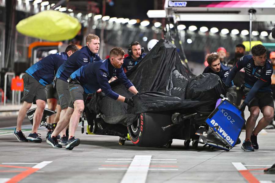 Colapinto's damaged car is wheeled back into the Williams garage