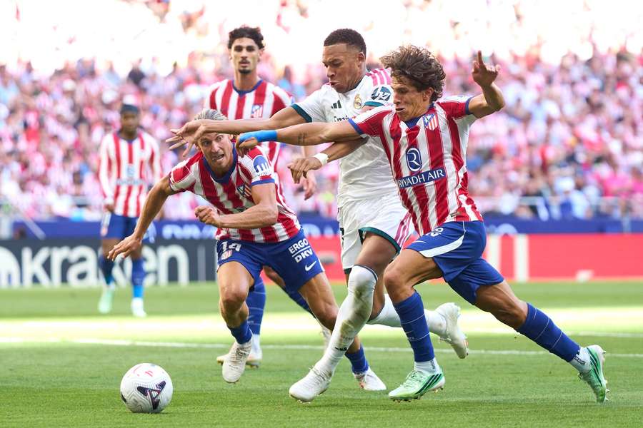 Atletico Madrid's Giuliano Simeone challenges Real Madrid's Kylian Mbappe Atletico Madrid's Giuliano Simeone challenges Real Madrid's Kylian Mbappe