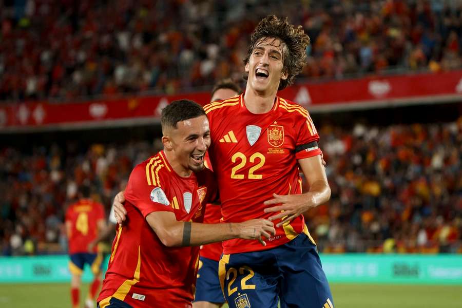 Bryan Gil (right) celebrates with teammate Yeremy Pino after scoring Spain's second goal