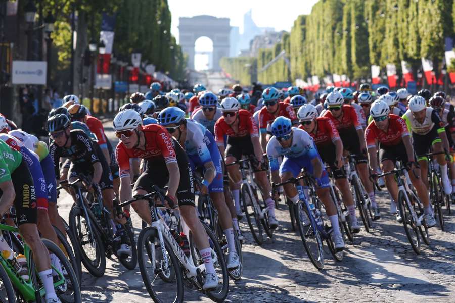 The pack of riders race on the Champs-Elysees during the 21st and final stage of the 109th edition of the Tour de France