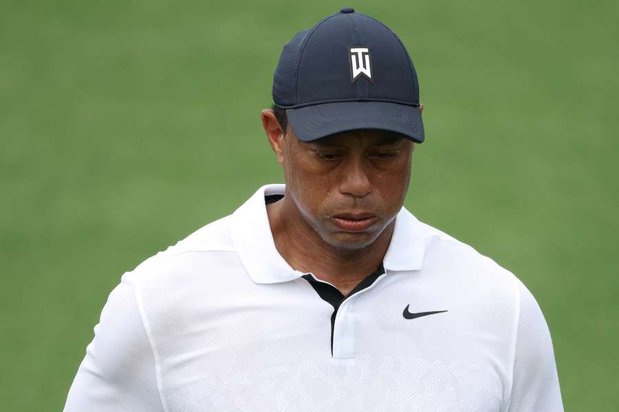 Tiger Woods walks on 18th tee box during the first round