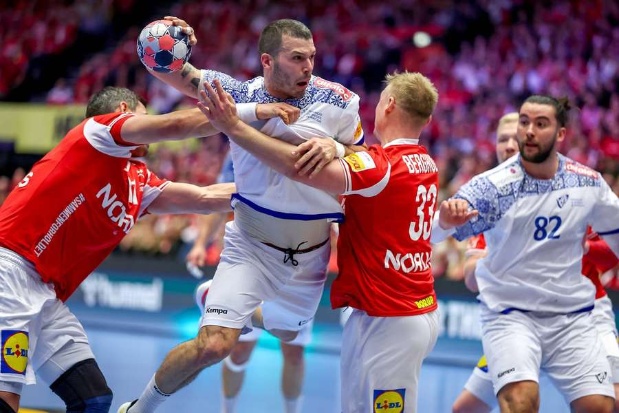 Portugal's Rui Sousa Martins Silva fights his way past  Rasmus Lauge and Emil Bergholt