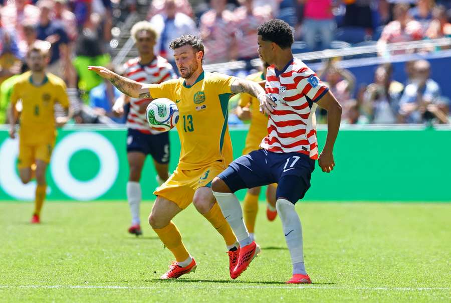 Australia's Aiden O'Neill in action with Malik Tillman of the USA Australia's Aiden O'Neill in action with Malik Tillman of the USA