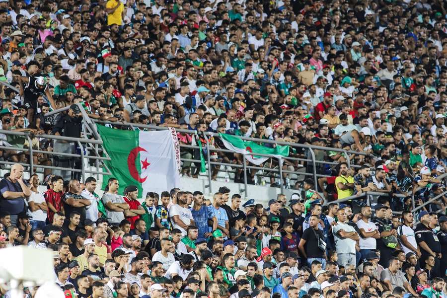 Algeria fans watch on during their qualifying match against Tanzania