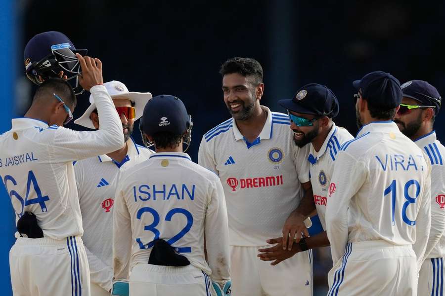 Ashwin and India celebrate taking a West Indies wicket