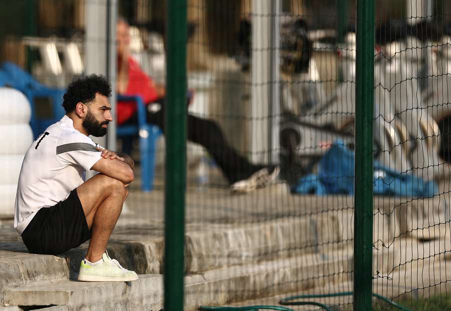 Mohamed Salah looks on as his teammates train