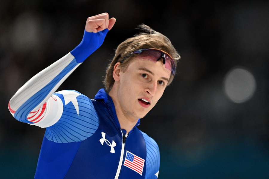 Jordan Stolz celebrates winning his race against Jenning de Boo in the 500m speed skating