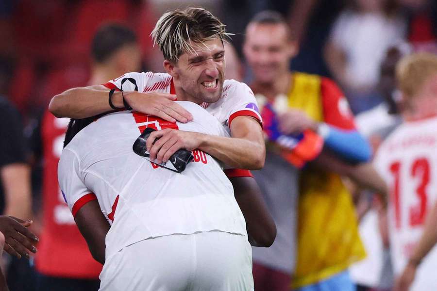 RB Leipzig's El Chadaille Bitshiabu and Kevin Kampl celebrate