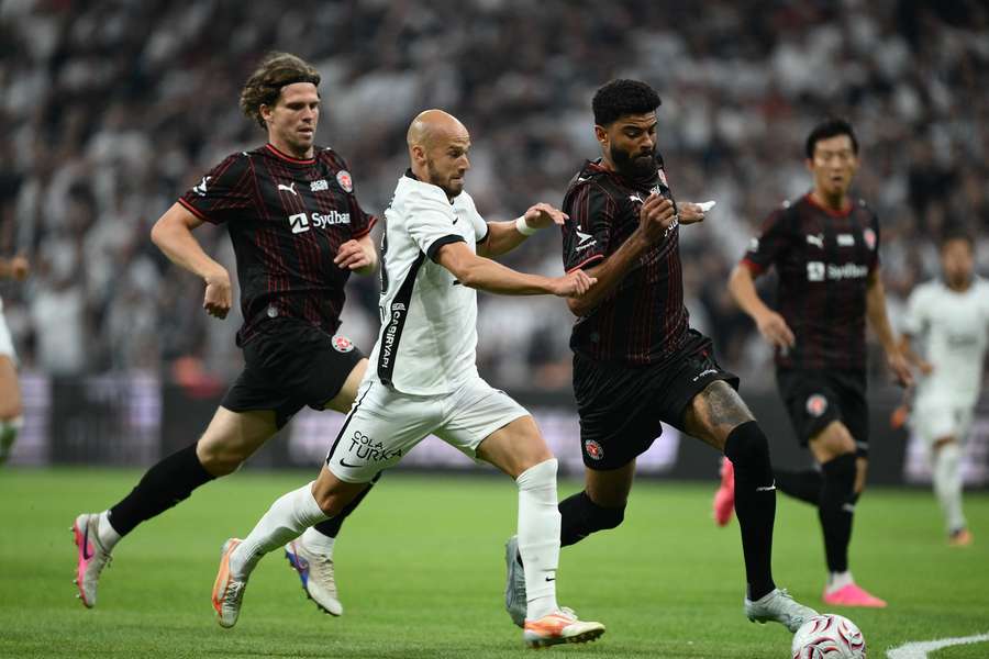 Vaclav Cerny (2nd L) of Besiktas competes against Philip Billing (R) of Midtjylland during the clash