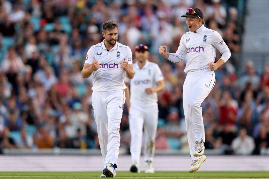 Chris Woakes alongside Ollie Pope