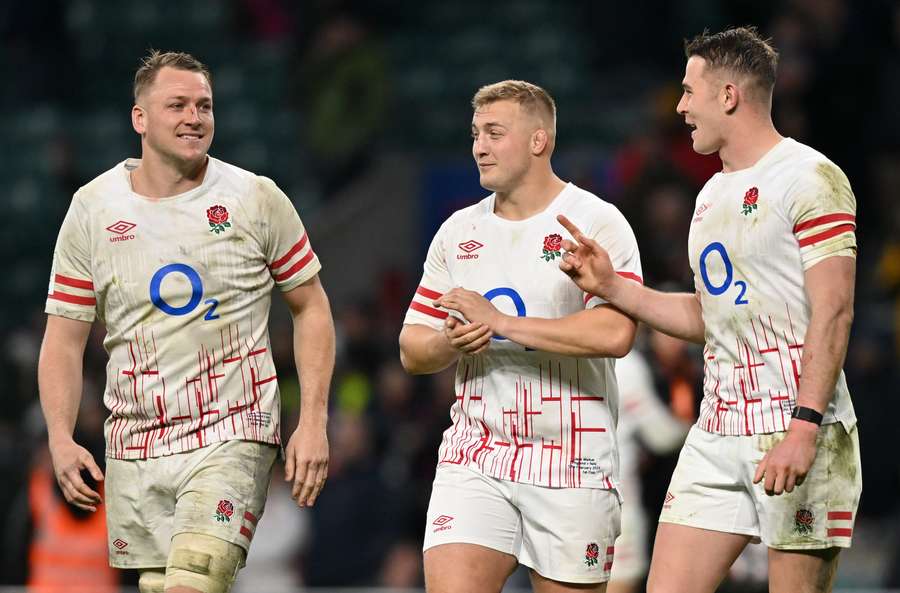 England's number 8 Alex Dombrandt, hooker Jack Walker and full-back Freddie Steward react following the match