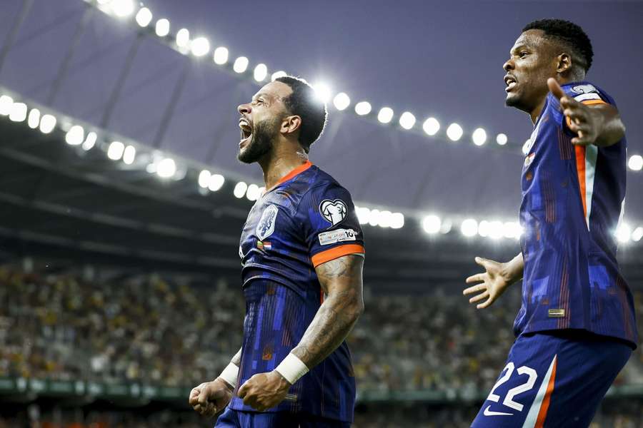 Memphis Depay (L) and Denzel Dumfries celebrate Oranje's 3-2 against Lithuania Memphis Depay (L) and Denzel Dumfries celebrate Oranje's 3-2 against Lithuania