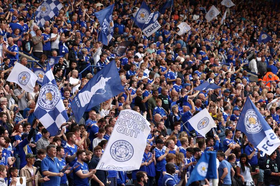 Leicester City's supporters cheer for their team prior to the English Premier League football match between Leicester City and West Ham United at King Power Stadium
