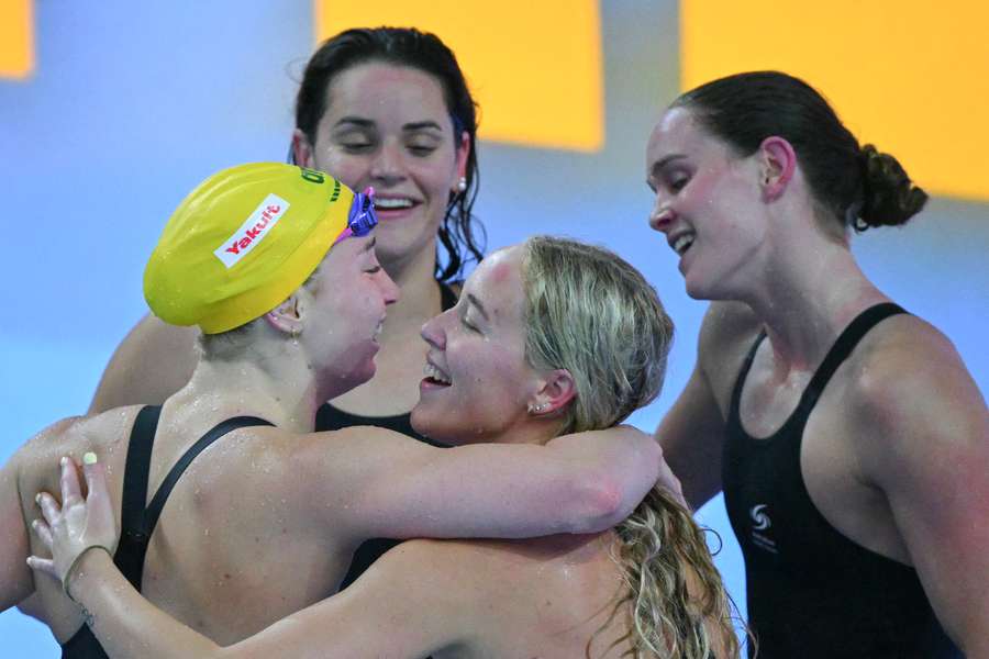 Australia celebrates their silver medal in the 4x100m medley relay. Australia celebrates their silver medal in the 4x100m medley relay.