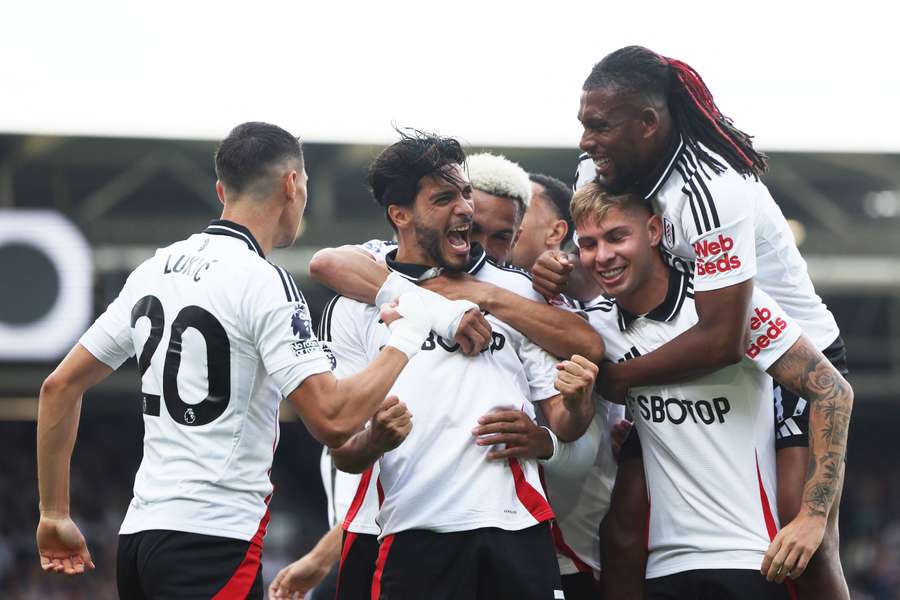 Raul Jimenez celebrates with teammates after giving Fulham an early lead