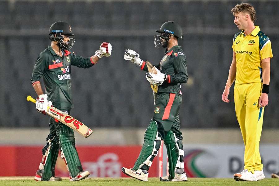 Bangladesh's Towhid Hridoy (left) and captain Mehidy Hasan Miraz celebrate their team's win over Australia Bangladesh's Towhid Hridoy (left) and captain Mehidy Hasan Miraz celebrate their team's win over Australia