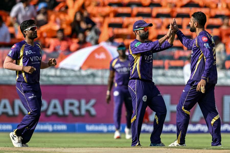 Varun Chakravarthy celebrates with teammates after removing Ravichandran Smaran