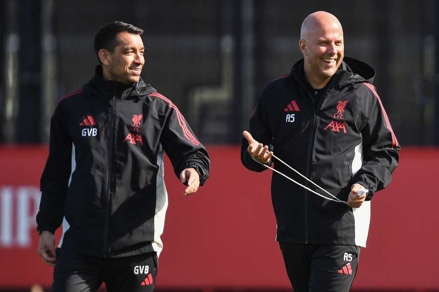 Giovanni van Bronckhorst (L) is currently the assistant to Liverpool manager Arne Slot