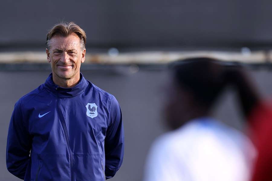 France's head coach Herve Renard looks at his players during a training session