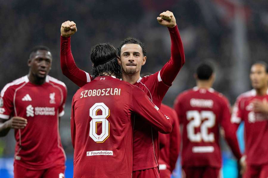 Liverpool’s Dominik Szoboszlai celebrates with Curtis Jones during the 5-1 win at Eintracht Frankfurt