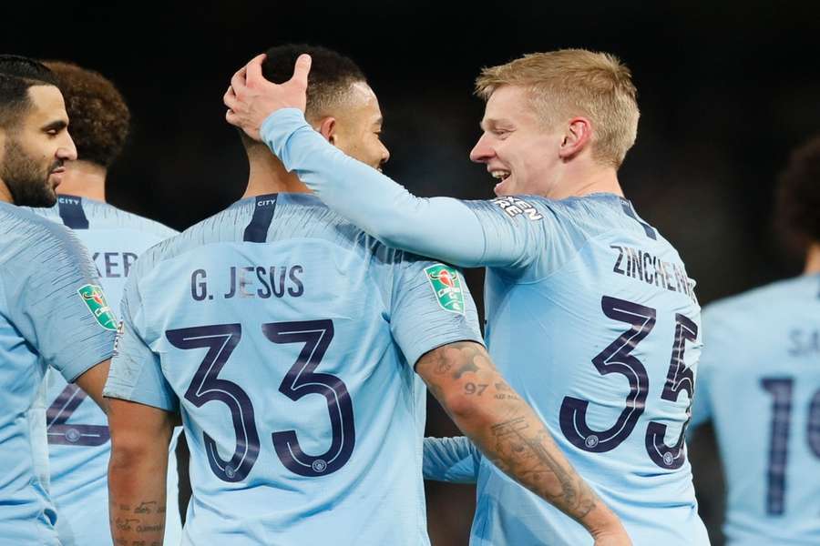 Gabriel Jesus (L) and Oleksandr Zinchenko playing for City in 2019