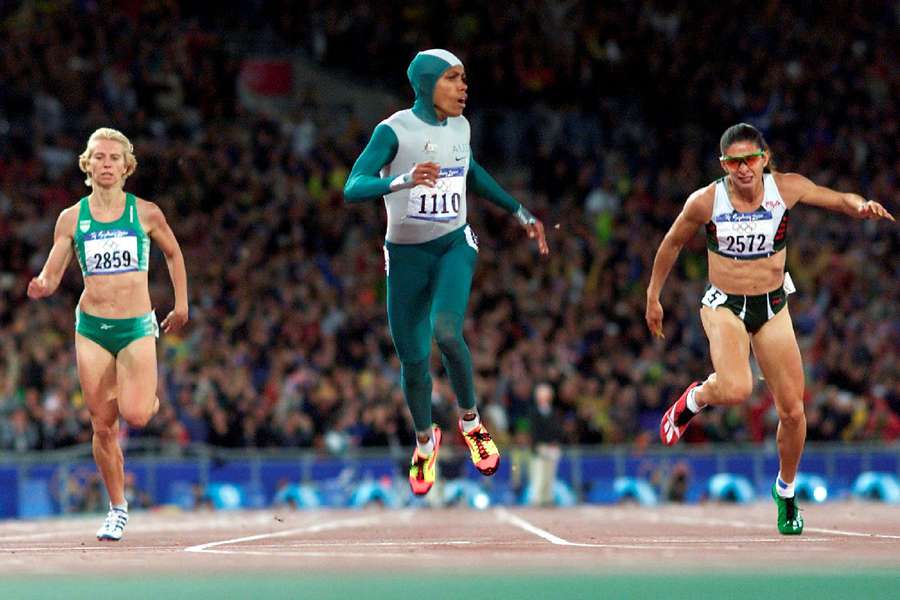 Freeman (C) crosses the finish line to win the womens 400m final at the Sydney Olympic Games in 2000