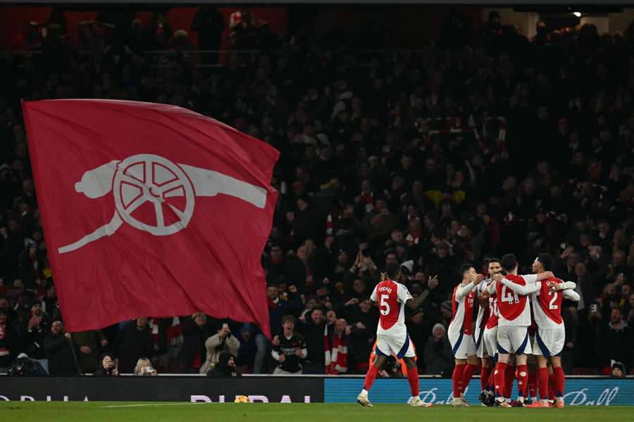 Ethan Nwaneri celebrates with teammates after scoring Arsenal's fifth goal