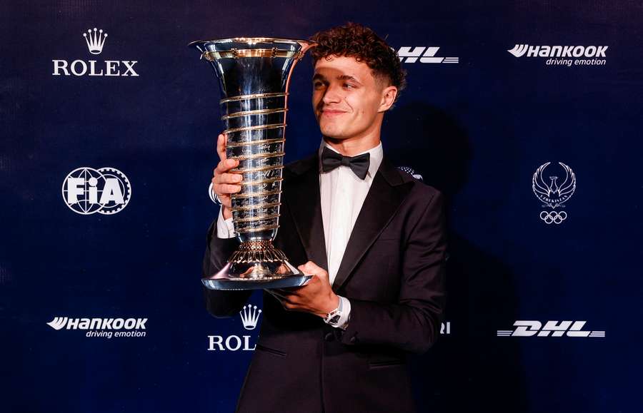 Lando Norris with the Formula One Championship Trophy during the FIA Awards 2025 in Tashkent, Uzbekistan