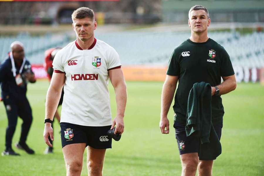 Owen Farrell (L) alongside Lions assistant coach Johnny Sexton (R)