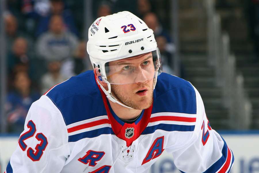 Rangers defenceman Adam Fox looking on during a break mid-game (2025)