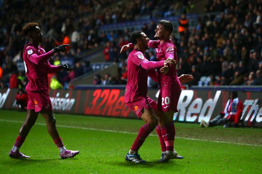 Liam Cullen of Swansea City celebrates scoring their side's second goal against Coventry