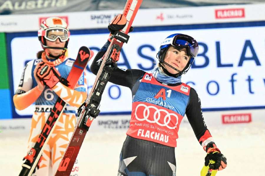 Second-placed Petra Vlhova (L) and winner Mikaela Shiffrin celebrate after the second run of the slalom event